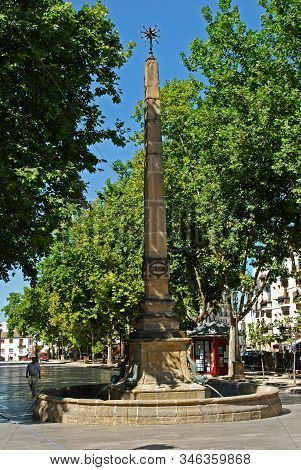 Baeza, Spain - July 28, 2008 - Large Fish Fountain With Obelisk Along The Plaza De La Constitucion I