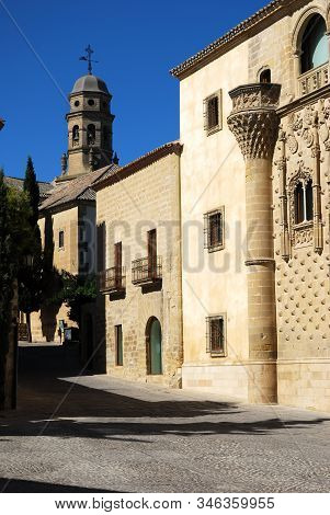 Baeza, Spain - July 28, 2008 - View Of Jabalquinto Palace With The Cathedral Bell Tower To The Rear,