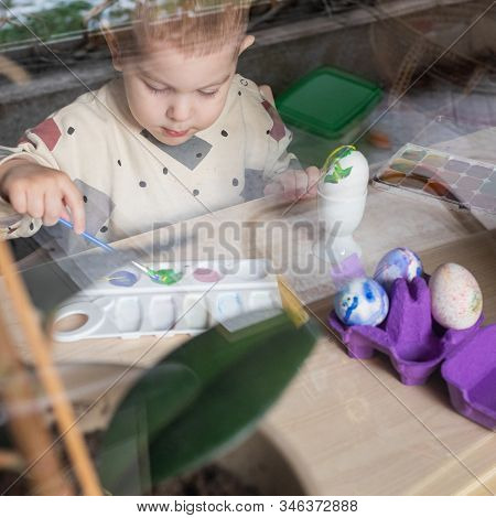 Toddler Boy Painting Easter Eggs Preparing For Holidays. Easter Tradition