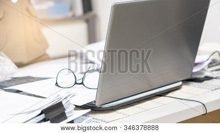 Business Office Desk Concept.stack Of Paper,desktop Laptop And Annual Report Placed On Table.