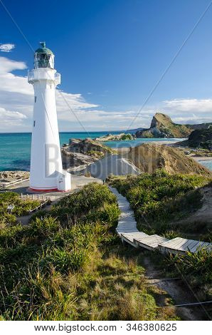 Castle Point Lighthouse In Wairarapa, New Zealand, During Golden Hour