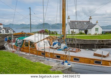 Retro Wooden Sailng Boat Docked At Crinan Canal, Scotland.