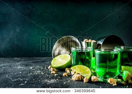 Three Shot Glasses With Absinthe