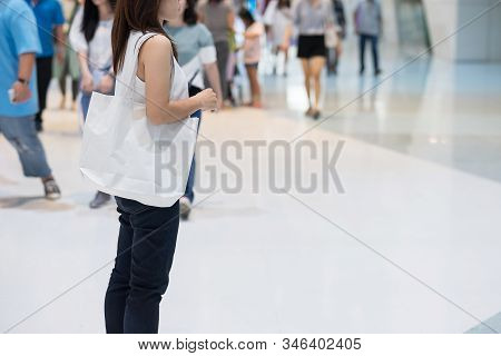 Woman Hand Holding Eco Shopping Bag In Store Background With Copy Space For Text. Environmental Prot