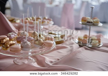 Candy Bar Served With Macaroons, Choux Pastry And Cake Pops In Restaurant, Copy Space. Dessert Table