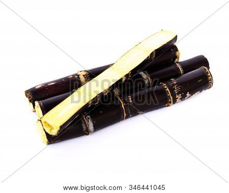 Studio Shot Heap Of Organic Sugarcane Stalks With Half Cuts Isolated On White
