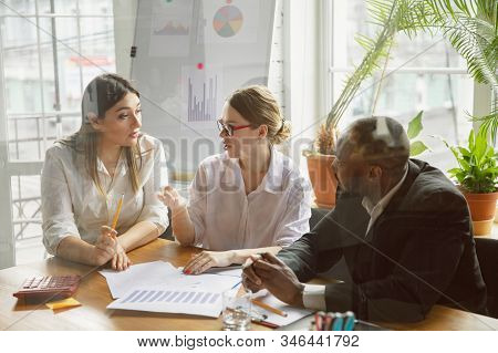 Modern Work. Group Of Young Business Professionals Having A Meeting. Diverse Group Of Coworkers Disc