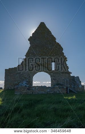 The Sun Hid Behind The Ruins Kapelludden On Oland, Sweden. Saint Birgittas Chapel Ruin On A Sunny Sp