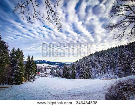 View Of Ski Slope In Ore Mountains, Czech Republic. In The Background Is The Mountain Plesivec. Ther