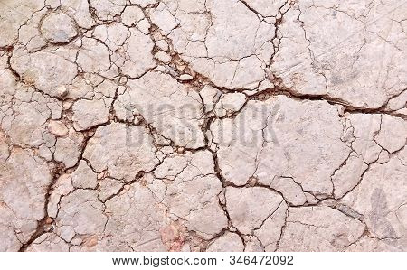 Photo Of Arid Land Or Close-up  Broken Ground. Images Of  Soil  Texture Background From Top View.  R