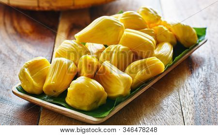 pile of peeled jackfruit on banana leaf serving tray,