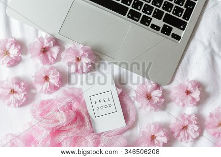 Flay Lay, Top View Office Table Desk. Feminine Desk Workspace Frame With Sakura Flowers On White Bac