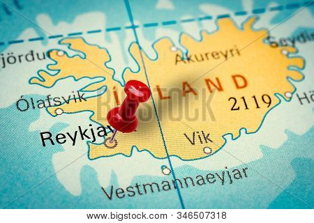 Prague, Czech Republic - January 12, 2019: Red Thumbtack In A Map. Pushpin Pointing At Reykjavík Cit