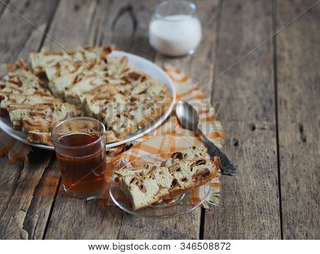 Traditional Apple Pie, Cupcake With Dried Apples, Closeup Presented On A Wooden Table. Home Cooking.