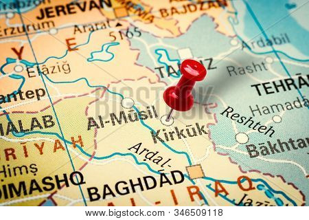 Prague, Czech Republic - January 12, 2019: Red Thumbtack In A Map. Pushpin Pointing At Kirkuk City I