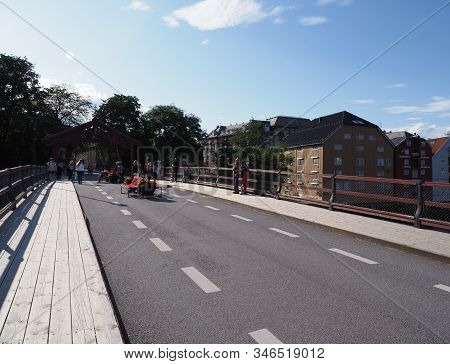 Trondheim, Norway On July 2019: Wooden Town Bridge Over Nidelva River In European City At Trondelag 