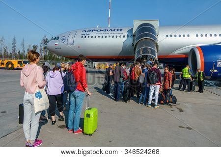 Moscow, Russia - August 15, 2019: Passengers boarding to Aeroflot company aircraft at Sheremetyevo airport