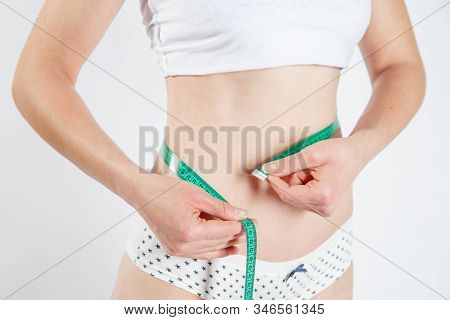 Woman Body After Weight Loss. Cropped Close Up Photo Of Fatless Slender Body Parts And Proportions W