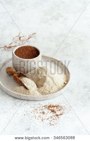 Teff Flour On A Plate And Teff Grain In A Bowl Close Up