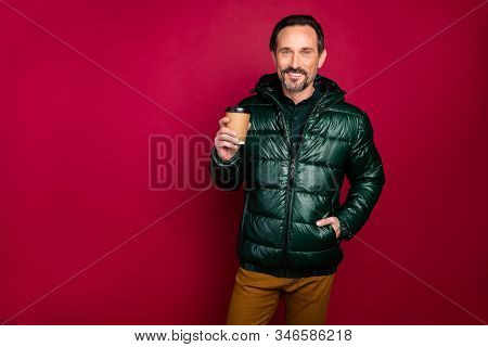 Photo Of Cheerful Handsome Man Holding Cup Of Mulled Wine To Warmen Himself In Cold Winter Evening I