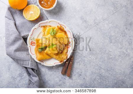 Crepe Suzette. Traditional French Crepe Suzette With Orange Sauce . Top View, Flat Lay