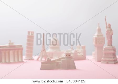 Selective Focus Of Great Wall Figurine Near Statuettes On Grey And Pink