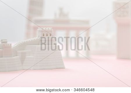 Selective Focus Of Small Great Wall Figurine Near Statuettes On Grey And Pink