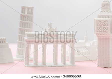 Selective Focus Of Brandenburg Gate Figurine Near Big Ben Tower Statuette On Grey And Pink