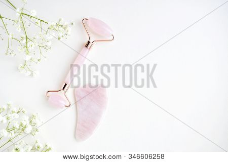 Pink Guasha Massage Tool On White Background. Rose Quartz Jade Roller. Skin Care At Home, Anti-aging