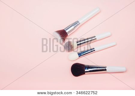 Set Kit Makeup Brushes On Pink Background, Copy Space