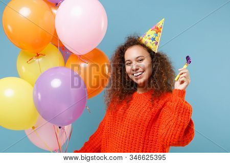 Cheerful Young African American Girl In Casual Orange Knitted Clothes, Birthday Hat Isolated On Past