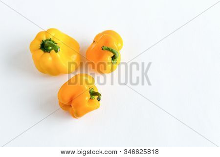 Deformed Bell Peppers Isolated On A White Background. Organic Vegetables With An Ugly Shape. Imperfe