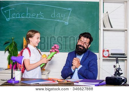 Back To School. Happy Teachers Day. Small School Girl Kid With Flower Bouquet. Teachers Day. Daugght