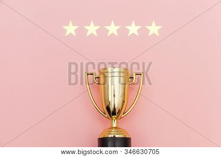 Simply Flat Lay Design Winner Or Champion Gold Trophy Cup And 5 Stars Rating Isolated On Pink Pastel