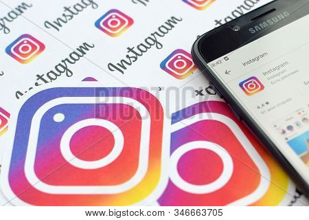 Instagram App On Samsung Smartphone Screen On Banner With Small Instagram Logos. Instagram Is Americ