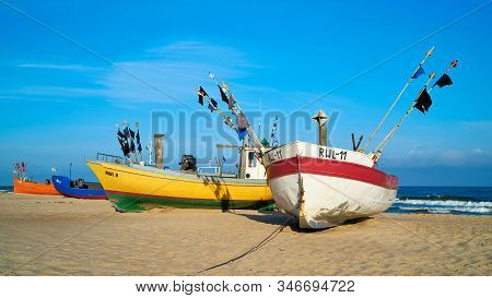 Rewal, Poland - September 04, 2019: Fishing Boats On The Beach Of The Polish Baltic Coast Near Rewal
