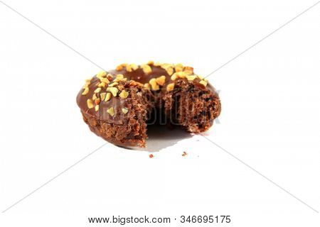 chocolate Donut with peanuts. isolated on white. room for text. clipping path. People world wide enjoy donuts. Enjoy a Donut today. 