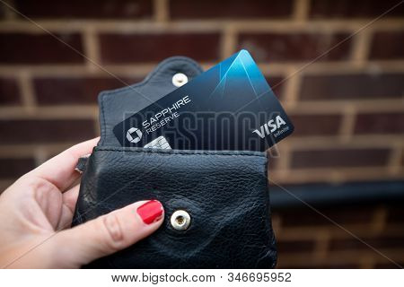 Bethesda, Md / Usa - Nov. 10, 2019: A Hand Holds A Chase Sapphire Reserve Credit Card, Which Gives U