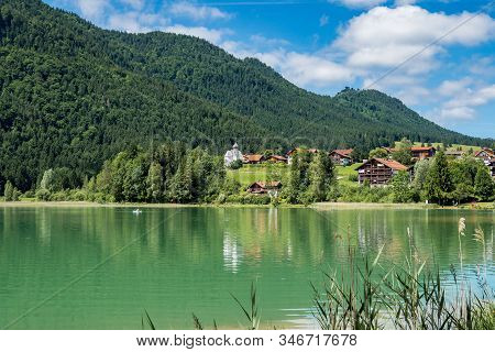 Weissensee Lake In The Bavarian Alps Near Fuessen, Allgaeu, Bavaria, Germany
