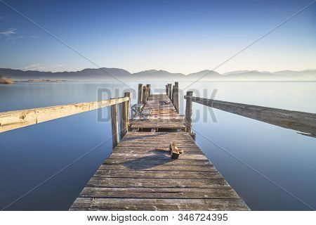 Wooden Pier Or Jetty And Lake At Sunrise. Long Exposure. Torre Del Lago Puccini, Versilia, Massaciuc