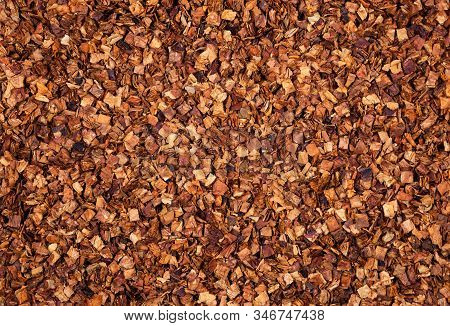 Dried Chopped Smoking Tobacco Background. Top View. Tobacco Texture.
