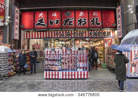 Osaka, Japan- 28 Nov, 2019: Souvenirs Shops With Kuidaore Taro Clown Decorated Goods In Dotombori Os