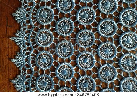 Sky Blue Crochet Lace Edge On Wooden Table