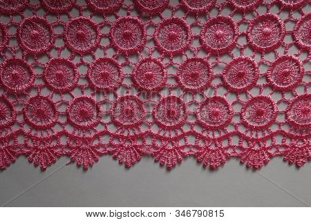 Edge Of Bright Pink Crochet Lace On Neutral Background