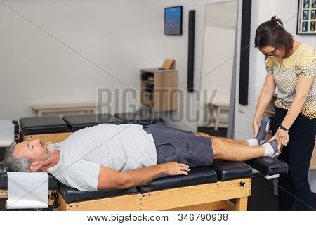 Man Having Chiropractic Back Adjustment. Physioterapy, Osteopathy, Alternative Medicine Pain Relief 