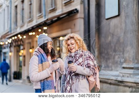 Happy Brightful Positive Moments Of Two Stylish Girls Hugging On Street In City. Closeup Portrait Fu