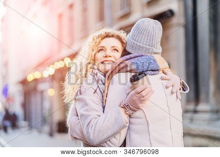 Happy Brightful Positive Moments Of Two Stylish Girls Friends Hugging On Street. Closeup Portrait Fu