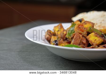 Top Down View Of Paneer Shimla Mirch Or Paneer Capsicum Or Tofu Capsicum On A Grey Background, Selec