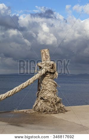 Rope On Seafront, Sea And Beautiful Cloudy Sky In Sunny Summer Day. Turkey, Erdek, Coast Of Marmara.