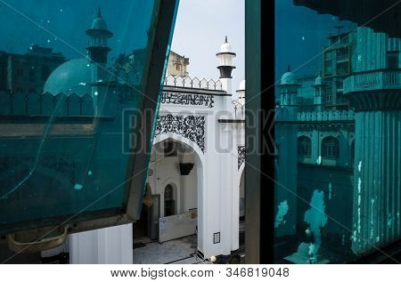 Yangon, Myanmar - December 29, 2019: Mogul Shiah mosque's view from window of opposite building